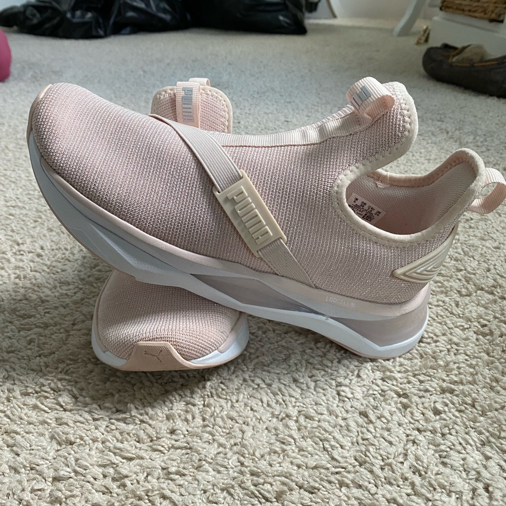Pink slip on Puma sneakers